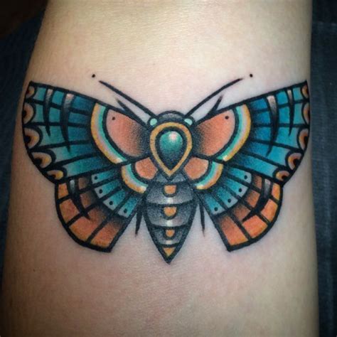 girly moth tattoo